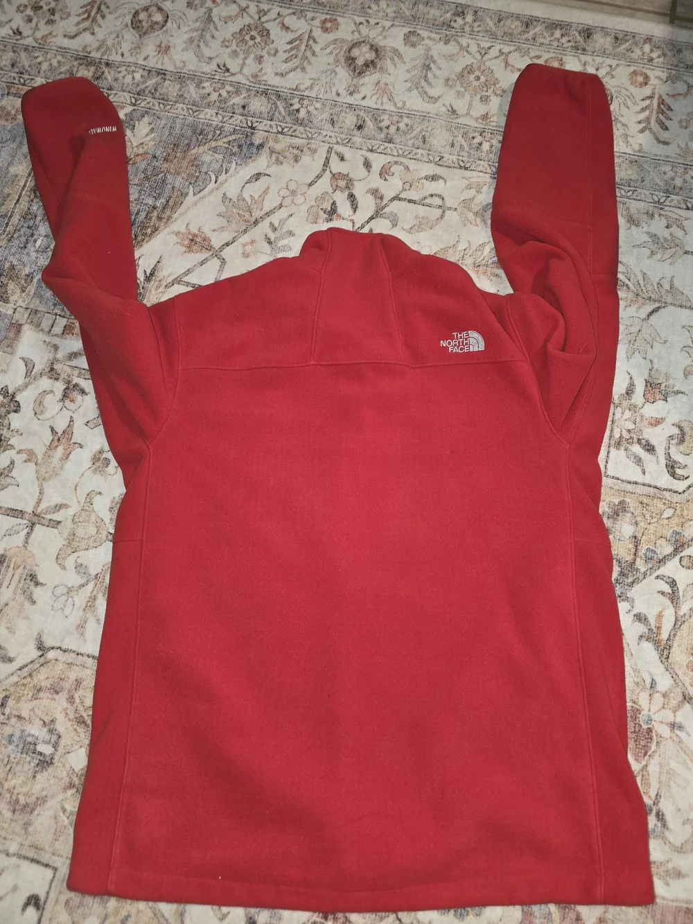 The North Face Wind Wall Red Fleece Jacket.